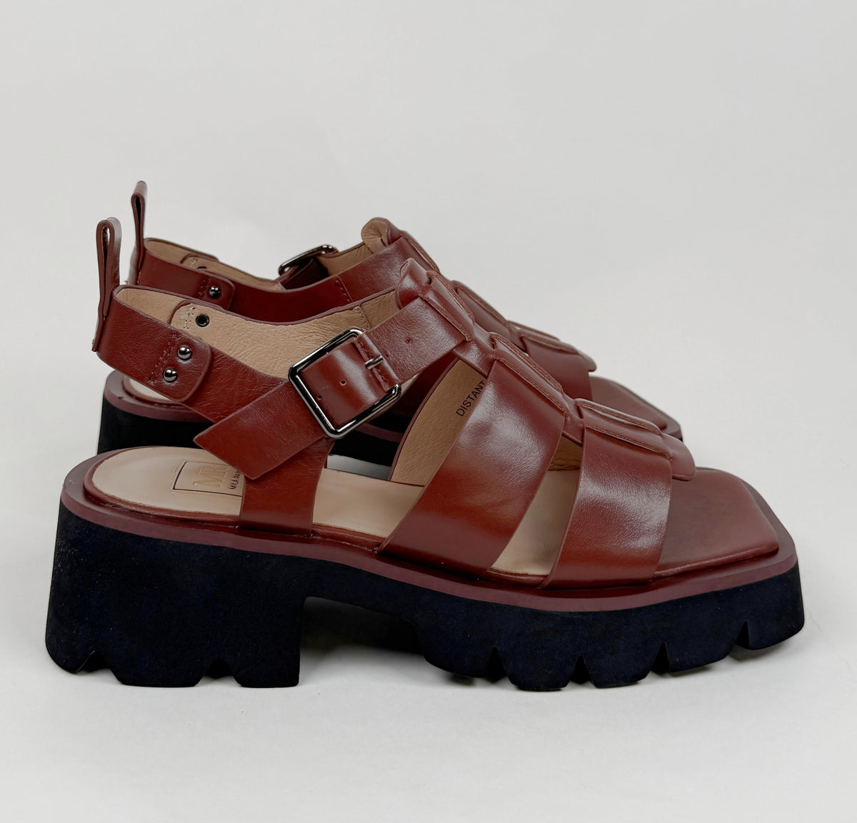 Mila Raine distant brown oiled