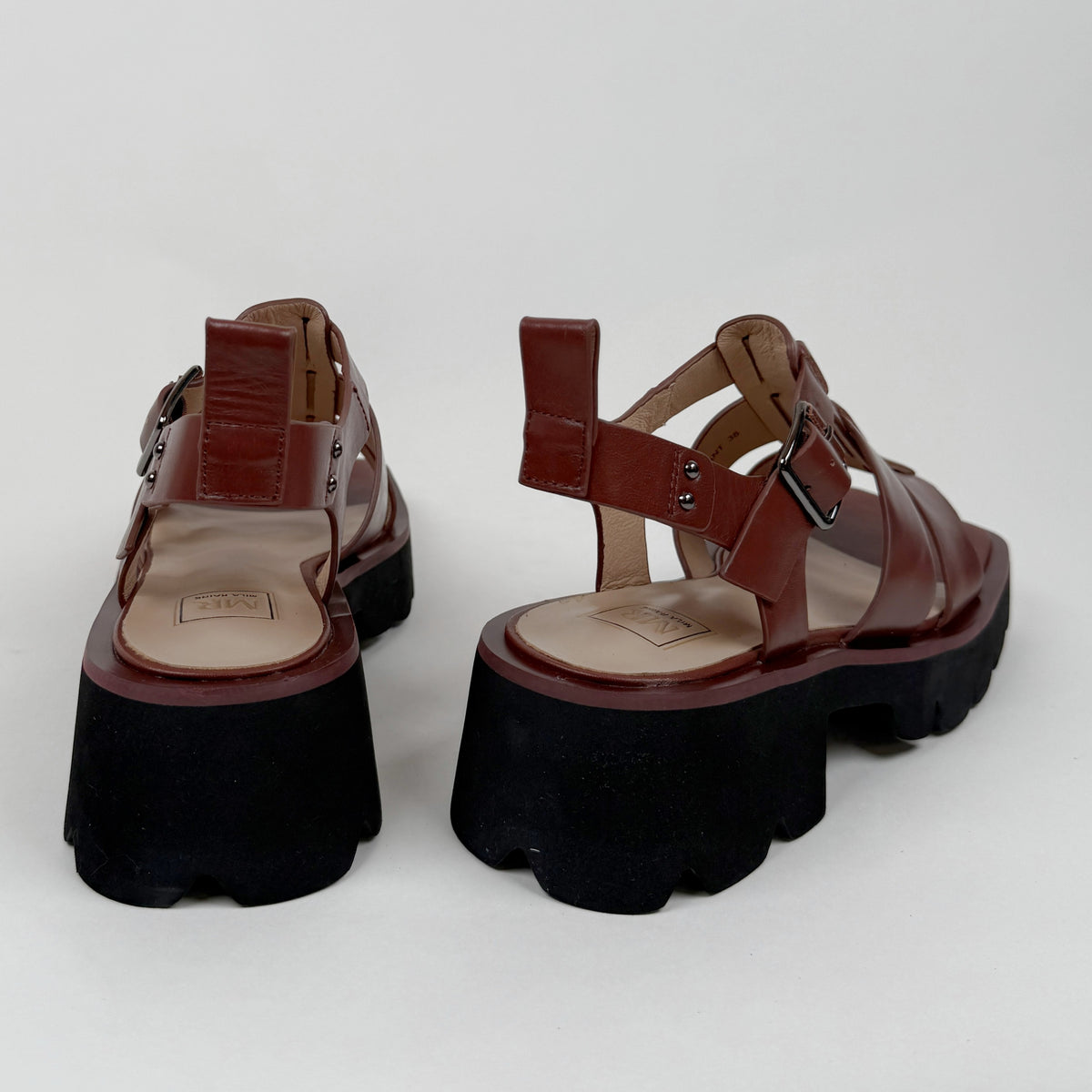 Mila Raine distant brown oiled